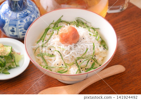 A perfect dish for summer: chilled rice porridge with boiled whitebait, pickled plums, and shiso leaves. A perfect dish for summer: chilled rice porridge with boiled whitebait, pickled plums, and shiso leaves. 141924492