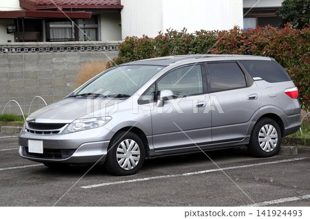 A passenger car parked in a parking lot A passenger car parked in a parking lot 141924493