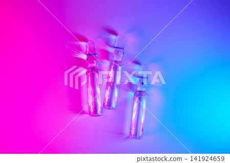 Medical ampoules showcasing weight loss innovation in neon light Medical ampoules showcasing weight loss innovation in neon light 141924659