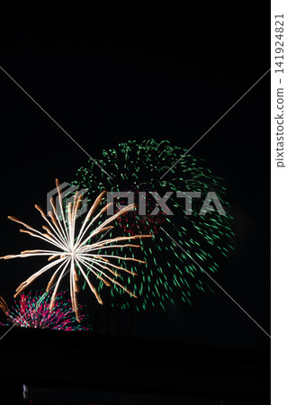Large fireworks that color the night sky Large fireworks that color the night sky 141924821