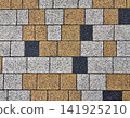 Paving Slabs Pattern Background with Yellow White and Dark Grey Cobblestones 141925210