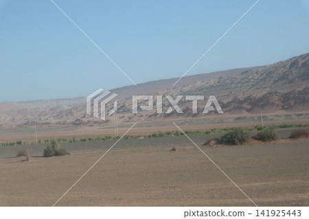 The Flaming Mountains, one of the famous landmarks in the Turpan Basin along China's Silk Road. The Flaming Mountains, one of the famous landmarks in the Turpan Basin along China's Silk Road. 141925443