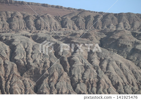 The Flaming Mountains, one of the famous landmarks in the Turpan Basin along China's Silk Road. The Flaming Mountains, one of the famous landmarks in the Turpan Basin along China's Silk Road. 141925476