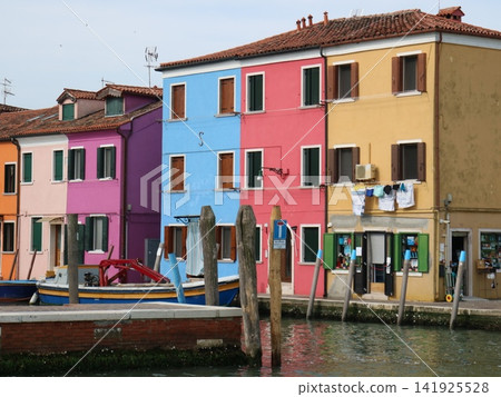 Colorful houses lining the canal on the island of Burano, Italy Colorful houses lining the canal on the island of Burano, Italy 141925528