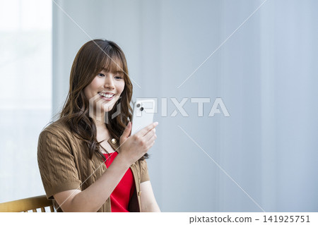 Young woman, smartphone, smiling, search Young woman, smartphone, smiling, search 141925751