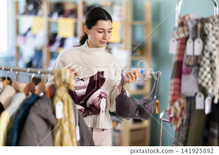 Regular customer Armenian woman chooses color and style of bra Regular customer Armenian woman chooses color and style of bra 141925892