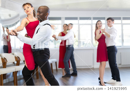 Adult man and adult woman dance tango Adult man and adult woman dance tango 141925995