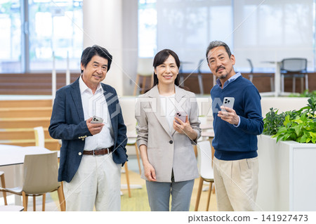 Executive businessmen working in an office. Filming assistance provided by: Denpa Gakuen Educational Foundation, Tokyo Electronics College. Executive businessmen working in an office. Filming assistance provided by: Denpa Gakuen Educational Foundation, Tokyo Electronics College. 141927473