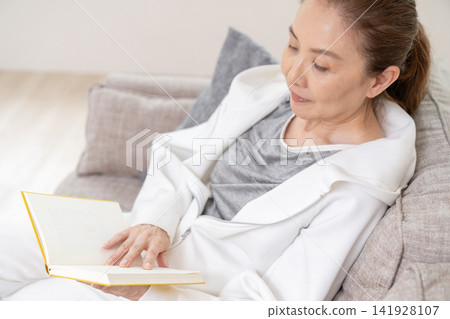 Senior woman reading a book Senior woman reading a book 141928107