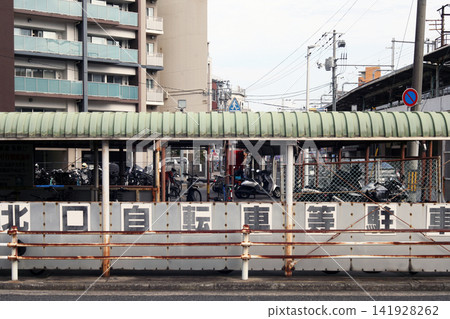 Bicycle parking lot in front of the station Bicycle parking lot in front of the station 141928262