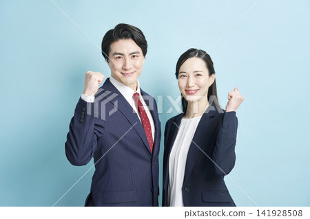 Male and female business people doing guts pose Male and female business people doing guts pose 141928508