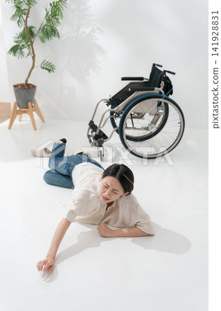 A woman who fell out of her wheelchair A woman who fell out of her wheelchair 141928831