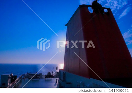 A view from a ship sailing across a blue sky and the vast ocean. A view from a ship sailing across a blue sky and the vast ocean. 141930051