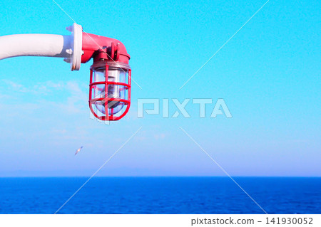 A view from a ship sailing across a blue sky and the vast ocean. A view from a ship sailing across a blue sky and the vast ocean. 141930052