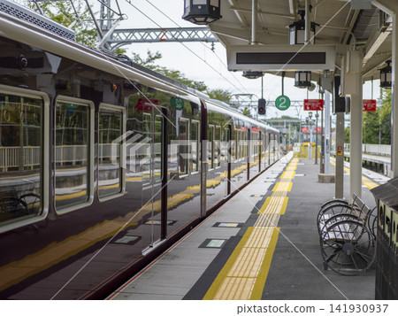 A Hankyu 8300 series train departing from Arashiyama Station. A Hankyu 8300 series train departing from Arashiyama Station. 141930937