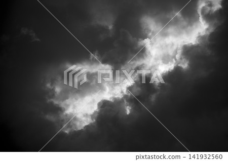 A dramatic scene: sunlight filtering through gaps in the clouds on Amami Oshima Island. 141932560
