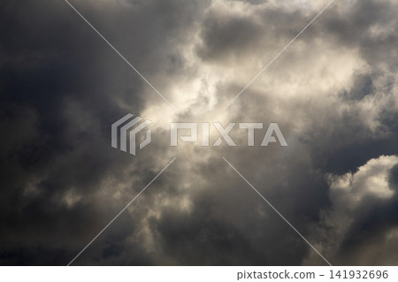 A dramatic scene: sunlight filtering through gaps in the clouds on Amami Oshima Island. A dramatic scene: sunlight filtering through gaps in the clouds on Amami Oshima Island. 141932696