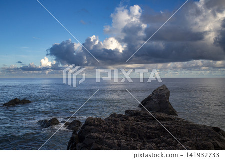 A dramatic scene: sunlight filtering through gaps in the clouds on Amami Oshima Island. A dramatic scene: sunlight filtering through gaps in the clouds on Amami Oshima Island. 141932733