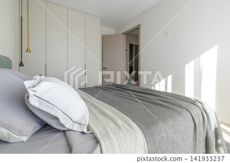 Modern Bedroom Interior with Wardrobe and Doorway View Modern Bedroom Interior with Wardrobe and Doorway View 141933237