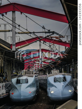 The Shinkansen trains lined up, one going up and one going down. The Shinkansen trains lined up, one going up and one going down. 141933356