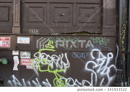 Graffiti on a wall in downtown New York, USA Graffiti on a wall in downtown New York, USA 141933522