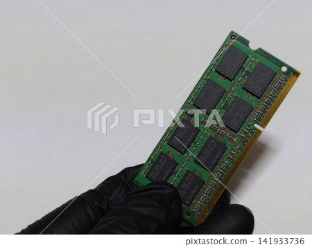 Hold one piece of laptop (PC) main memory (RAM) in your hand Hold one piece of laptop (PC) main memory (RAM) in your hand 141933736