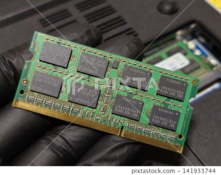 Hold one piece of laptop (PC) main memory (RAM) in your hand Hold one piece of laptop (PC) main memory (RAM) in your hand 141933744