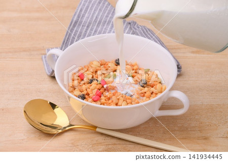 Breakfast cereal (granola and milk). Breakfast cereal (granola and milk). 141934445