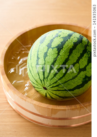 Watermelon chilled in a bucket Watermelon chilled in a bucket 141935063