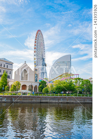 Summer in Yokohama's Minato Mirai district under a clear blue sky, showcasing the dynamic landscape of the waterfront and the city. Summer in Yokohama's Minato Mirai district under a clear blue sky, showcasing the dynamic landscape of the waterfront and the city. 141935926