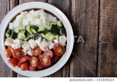 A small, single-serving Cobb salad-style chicken salad. A small, single-serving Cobb salad-style chicken salad. 141936014