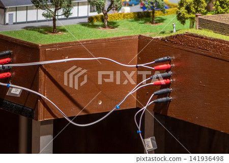 Wired model railway landscape diorama with electrical connectors on wooden frame Wired model railway landscape diorama with electrical connectors on wooden frame 141936498