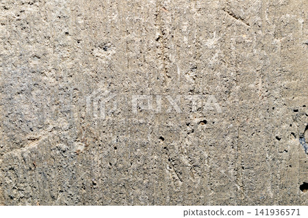 Close-up of rough concrete surface texture. Close-up of rough concrete surface texture. 141936571