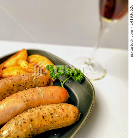 Sausages and red wine served on a plate Sausages and red wine served on a plate 141936626