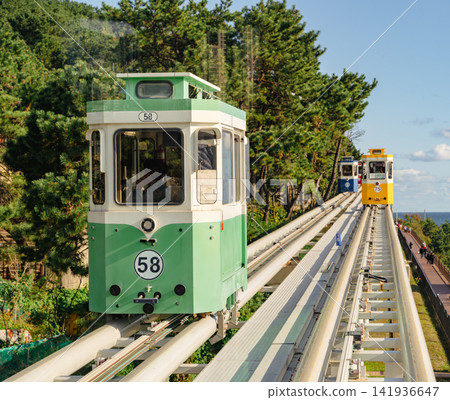 Haeundae Blueline Park, Busan, South Korea - Nov. 11, 2024: Sky Capsule trains. Haeundae Blueline Park, Busan, South Korea - Nov. 11, 2024: Sky Capsule trains. 141936647