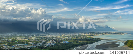 Aerial view of Hualien city, highlighting urban growth and Aerial view of Hualien city, highlighting urban growth and beautiful mountains and clouds Aerial view of Hualien city, highlighting urban growth and Aerial view of Hualien city, highlighting urban growth and beautiful mountains and clouds 141936714