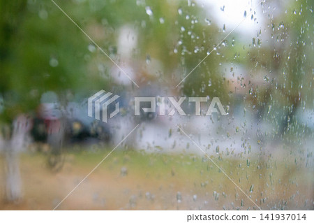 Rain drops on window glass. Abstract background texture. Weather forecast Antalya Turkey, Selective focus. High quality photo Rain drops on window glass. Abstract background texture. Weather forecast Antalya Turkey, Selective focus. High quality photo 141937014