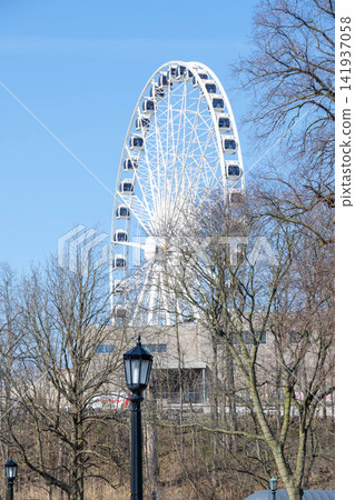 Ferris wheel attraction in the amusement park on the background of clear sky Niagara Falls, Ontario, Canada. High quality photo Ferris wheel attraction in the amusement park on the background of clear sky Niagara Falls, Ontario, Canada. High quality photo 141937058
