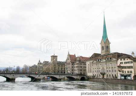Scenic summer view of the Old Town architecture of Zurich with the bridge Untertorbryukke over Aare river, Zurich, Switzerland. High quality photo Scenic summer view of the Old Town architecture of Zurich with the bridge Untertorbryukke over Aare river, Zurich, Switzerland. High quality photo 141937072