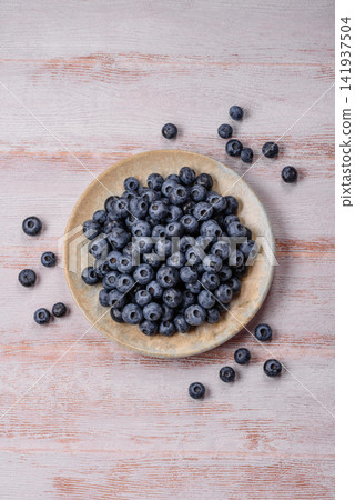 Fresh, ripe, and juicy wild blueberries as an ingredient for vegetarian dishes Fresh, ripe, and juicy wild blueberries as an ingredient for vegetarian dishes 141937504