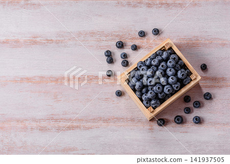 Fresh, ripe, and juicy wild blueberries as an ingredient for vegetarian dishes Fresh, ripe, and juicy wild blueberries as an ingredient for vegetarian dishes 141937505
