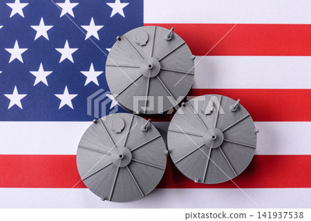 Liquefied gas storage tanks set against the USA flag as a background for your design 141937538