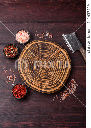 A square wooden cutting board for home food preparation. A wooden cutting board A square wooden cutting board for home food preparation. A wooden cutting board 141937539