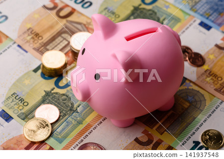 A piggy bank as a concept for storing, accumulating, and saving financial resources. A piggy bank A piggy bank as a concept for storing, accumulating, and saving financial resources. A piggy bank 141937548