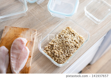 Cooked Quinoa and Raw Chicken Prepared for Healthy Meal Prep Cooked Quinoa and Raw Chicken Prepared for Healthy Meal Prep 141937657