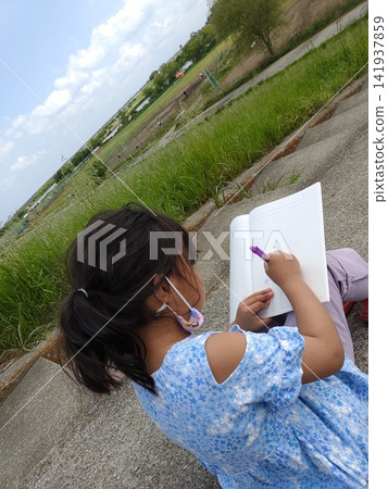 Children drawing pictures on the riverbank Children drawing pictures on the riverbank 141937859