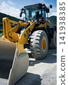 Loading soil and sand into dump trucks using an excavator at a construction site. 141938385