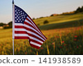 Usa flag waving in poppy field at sunset 141938589