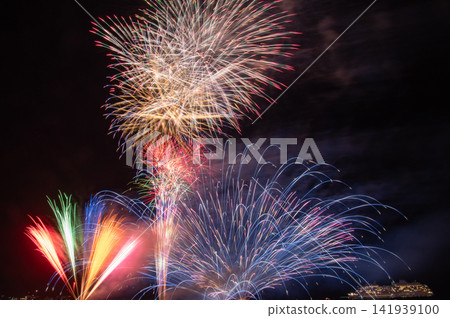 Tateyama Bay Fireworks Festival, with the Asuka III cruise ship anchored offshore. 141939100