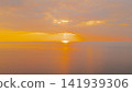 Aerial view of dramatic golden sunset over calm Ionian sea with sun rays breaking through clouds Kathisma beach area Lefkada island Greece travel landscape photo 141939306